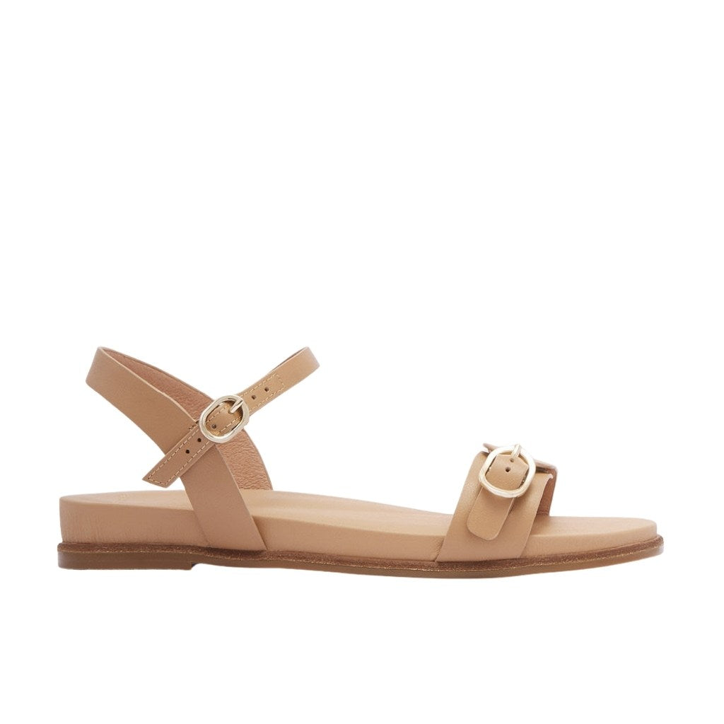 Beige sandal with a strap on a white background